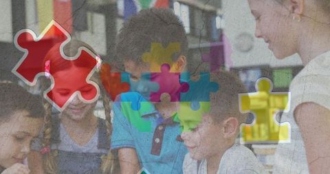 Children collaborating on tablets with autism awareness symbols