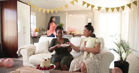Multiracial Female Friends Celebrating Birthday Occasion at Home