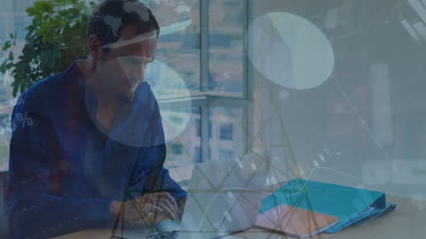 Businessman Analyzing Financial Data on Laptop in Office Setting