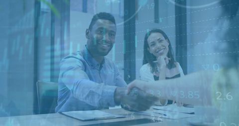 Business professionals meeting with financial data overlay
