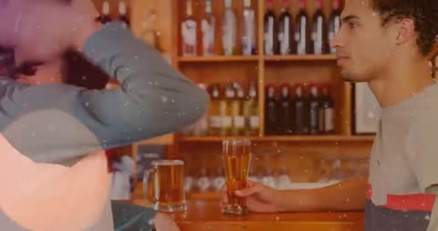 Two men chatting at rustic timber bar, one placing beer glass while other gesturing