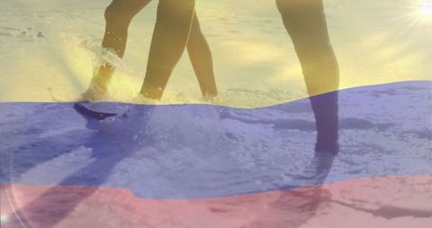 Couple wading in sunlit surf with tricolor flag overlay, summer beach leisure scene