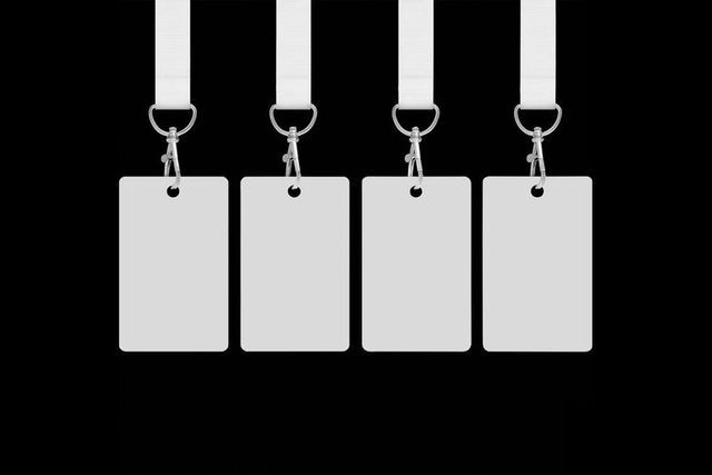 Blank badge cards on lanyards hanging symmetrically