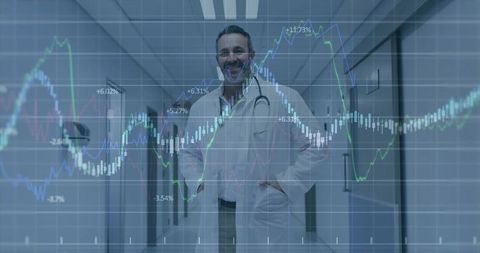 Doctor Standing in Hospital Corridor Wearing Stethoscope with Market Charts Overlay