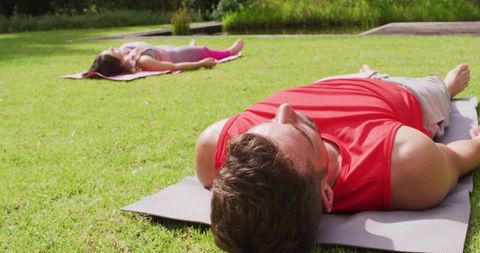 Couple Practicing Yoga Relaxing Outdoors Sunny Garden