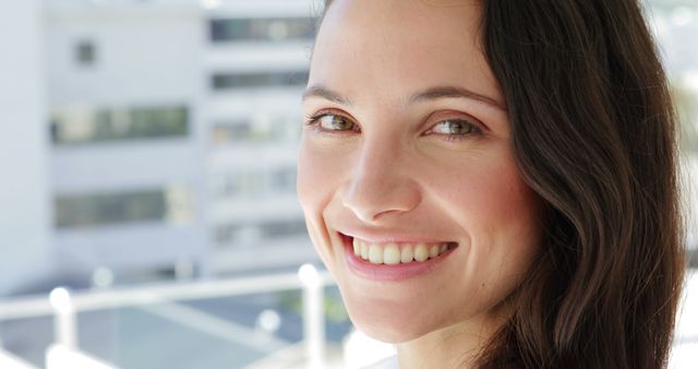 Smiling Woman with Long Brown Hair in Urban Setting - Download Free Stock Images Pikwizard.com