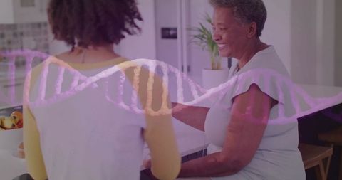 Senior woman and young adult sharing morning chat at kitchen island with dna helix overlay