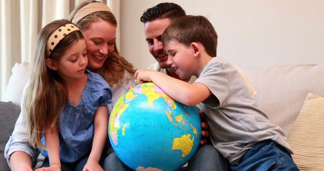 Family Learning Geography at Home with Globe - Download Free Stock Images Pikwizard.com