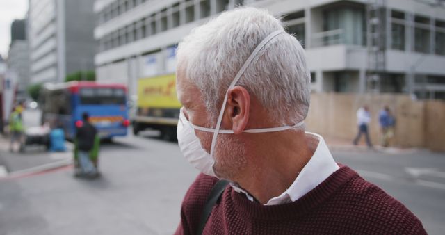 Senior Man Wearing Mask Outdoors in Urban Street Setting - Download Free Stock Images Pikwizard.com