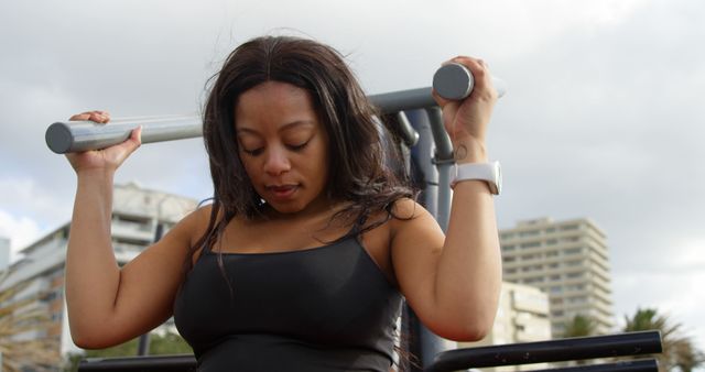 Woman Exercising on Pull-Up Bar Outdoors - Download Free Stock Images Pikwizard.com