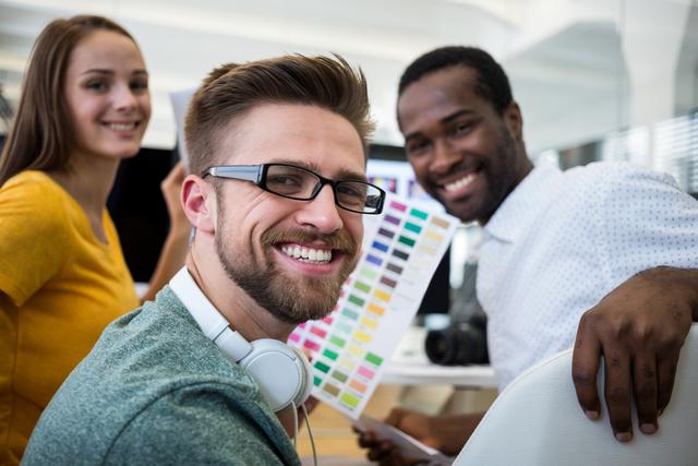 Group of graphic designers smiling in office
