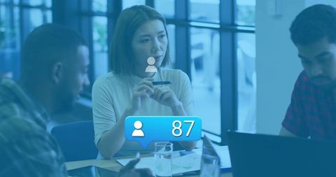 Focused Business Team Meeting With Market Data Overlay