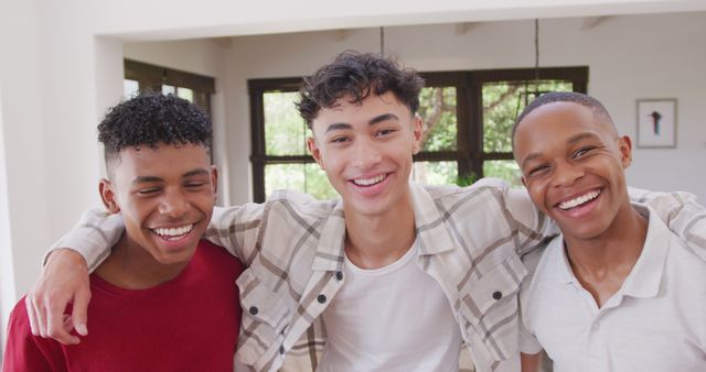 Three Teen Friends Smiling and Embracing Indoors - Download Free Stock Images Pikwizard.com