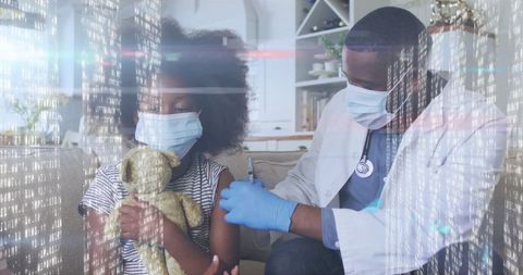 Child receiving vaccine from doctor in safe home environment