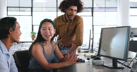 Multicultural team discussing business strategy in modern office