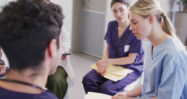 Image of caucasian female doctor talking with diverse medical colleagues in hospital meeting - Download Free Stock Photos Pikwizard.com