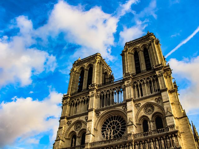 Notre-Dame Cathedral Under Blue Sky With White Clouds - Download Free Stock Photos Pikwizard.com
