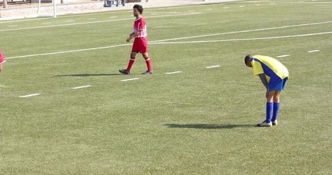 Youth Soccer Players Competing Intensely on Field