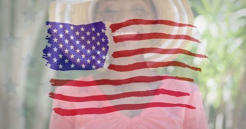 Smiling african american woman with usa flag overlay