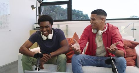 Diverse male friends co-hosting interactive podcast session