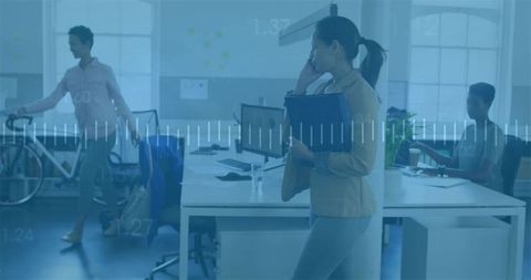 Professional Korean Woman Speaking on Smartphone in Modern Office