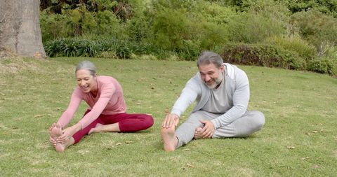 Senior Couple Enjoying Outdoor Stretching Exercises