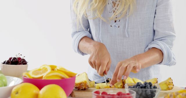 Woman Preparing Fresh Fruit Mix in Kitchen - Download Free Stock Images Pikwizard.com