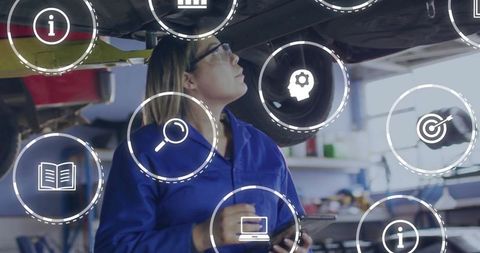 Technician using tablet for aircraft maintenance in hangar