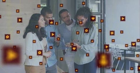 Business team collaborating on tablet with floating social media icons in modern office