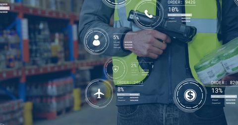 Warehouse worker using barcode scanner for order management