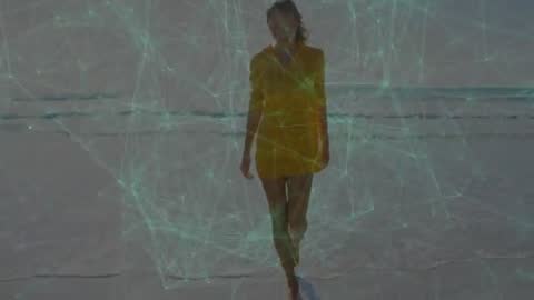 Woman Walking on Beach with Digital Connectivity Network