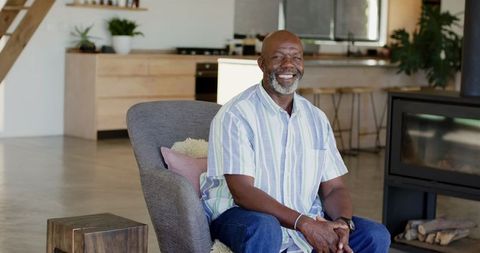 Smiling Man Relaxing in Modern Living Room