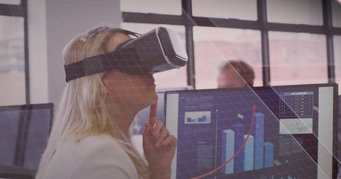 Mature professional exploring vr data visualization in modern office workspace