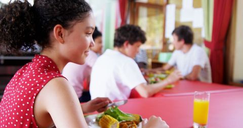 Teen Girl Dining with Friends, Smiling in Casual Setting