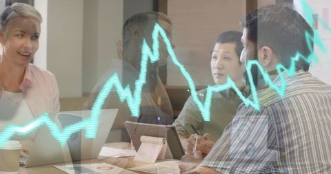 Business Team Collaborating on Financial Data with Graph Overlay