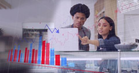 Diverse Couple Analyzing Data Over Digital Charts in Retail Setting