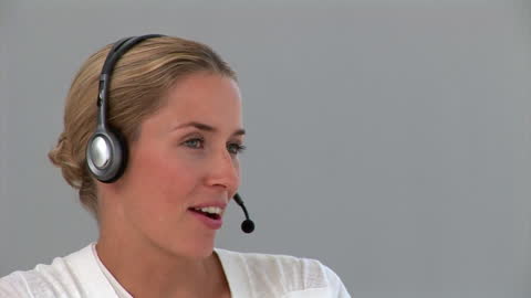 Confident Customer Service Agent with Headset in Call Center