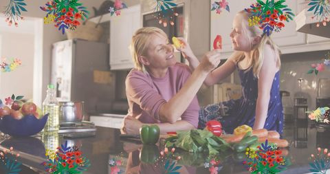 Mother and Daughter Enjoying Quality Time Cooking Together in Kitchen