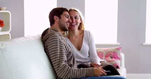 Happy Couple Enjoying Relaxing Time Together on Couch - Download Free Stock Images Pikwizard.com