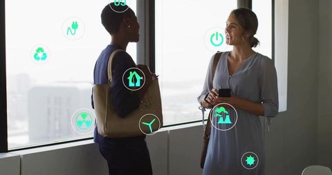 Professionals Discussing Sustainability with Eco Icons in Urban Office