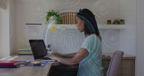 Focused Man Typing on Laptop with Futuristic Biometric Interface