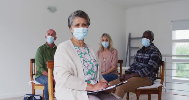 Diverse group in masks attending therapy session - Download Free Stock Images Pikwizard.com