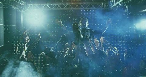 Energetic Male Crowd-Surfer Held by Fans at Livley Club Concert