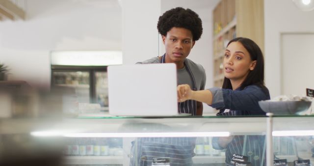 Small Business Owners Managing Online Orders in Bakery - Download Free Stock Images Pikwizard.com