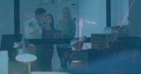 Team planning and reviewing sticky notes on glass with tablet and finance growth chart