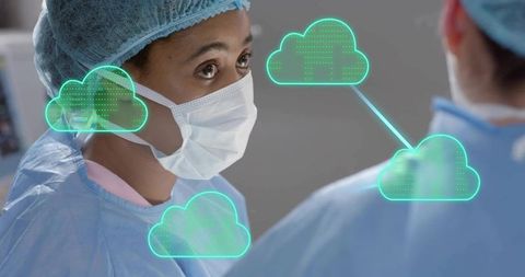 Female surgeon collaborating with team using cloud data overlay in operating room