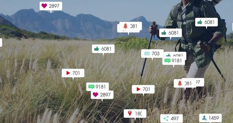 Hiker surrounded by social notification icons in scenic nature