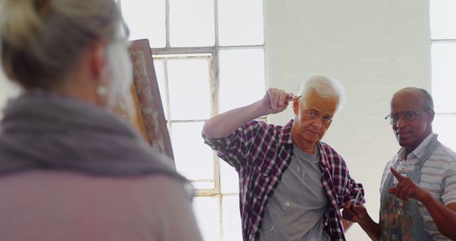 Senior men engaged in painting on canvas in an art studio, showing focus and creativity. Useful for concepts of retirement hobbies, senior activities, art classes, and lifelong creativity. Suitable for promoting art workshops, senior engagement programs, and creative lifestyle articles.