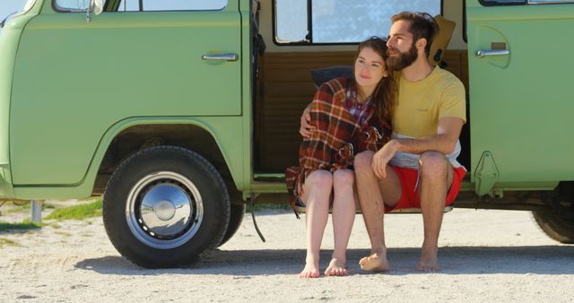 Young couple sitting van on a sunny day - Download Free Stock Photos Pikwizard.com