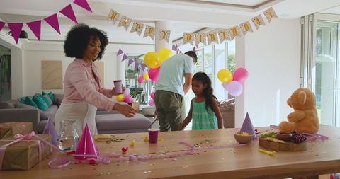 Diverse Family Preparing for Festive Birthday Celebration